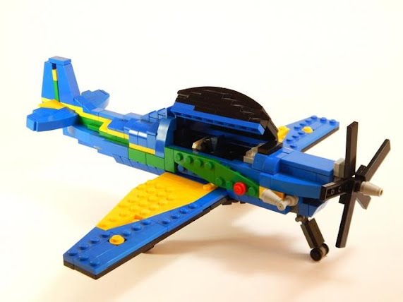 Avião Tucano a Pilha c/ Musica Luz E Movimento + Boneco Lego